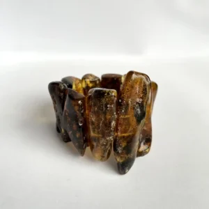 Elegant amber bracelet showcasing unique natural designs and warm golden hues.