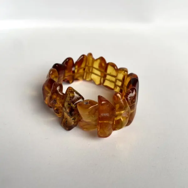 Chunky amber bracelet with polished pieces, showcasing natural beauty and historical inclusions.