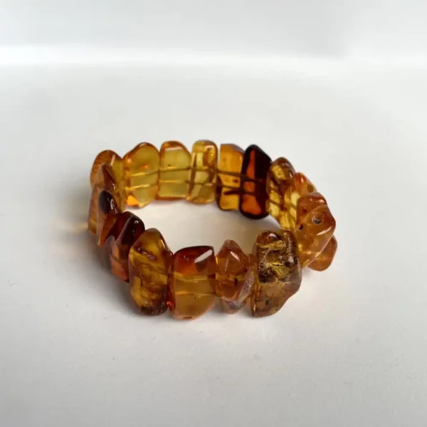 Stunning amber bracelet with unique beads showcasing rich colors and natural inclusions.