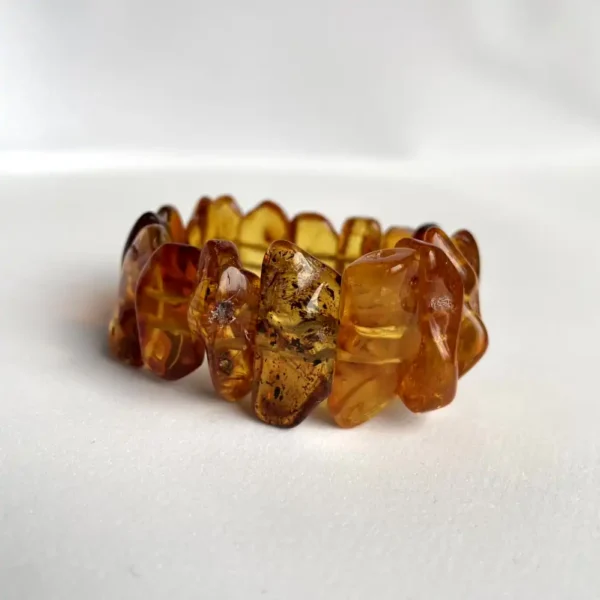 Unique amber bracelet with irregular pieces, showcasing warm hues and artisanal craftsmanship.