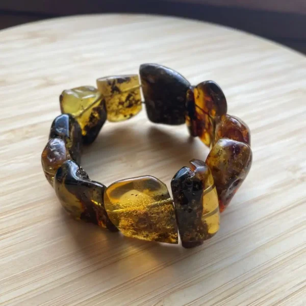 Elegant amber bracelet showcasing unique natural stones with warm hues and organic inclusions.