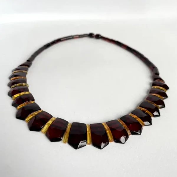 Elegant amber tortoiseshell necklace featuring hexagonal and trapezoidal links in rich colors.