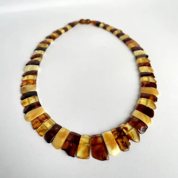 Elegant amber and cream stone necklace with a contemporary design for any occasion.