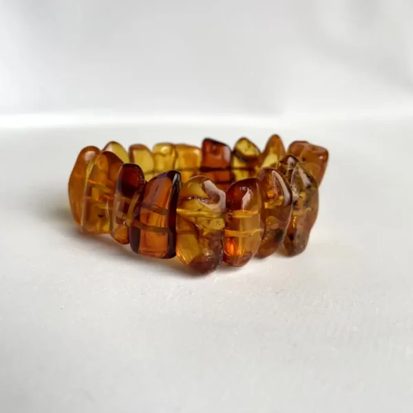 Stunning handcrafted amber bracelet featuring polished, irregular beads in warm golden hues.