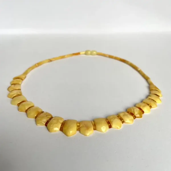 Elegant yellow bead amber necklace with polished stones, perfect for any occasion.