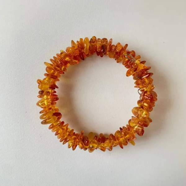 Stunning amber bracelet featuring polished stones in vibrant golden and orange hues.