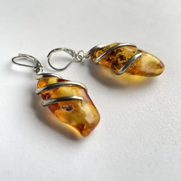 Elegant amber earrings radiate vintage charm and natural beauty for stylish wear.