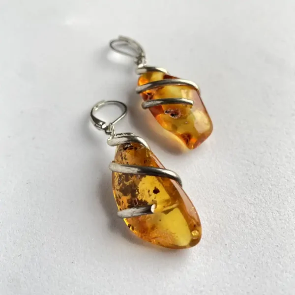 Elegant amber earrings, showcasing organic beauty and unique craftsmanship.