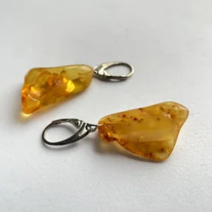 Elegant amber earrings, showcasing organic shapes and unique natural inclusions.