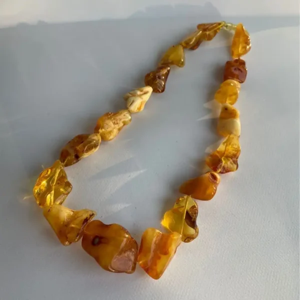 Stunning amber necklace with unique beads in warm hues, perfect for any occasion.