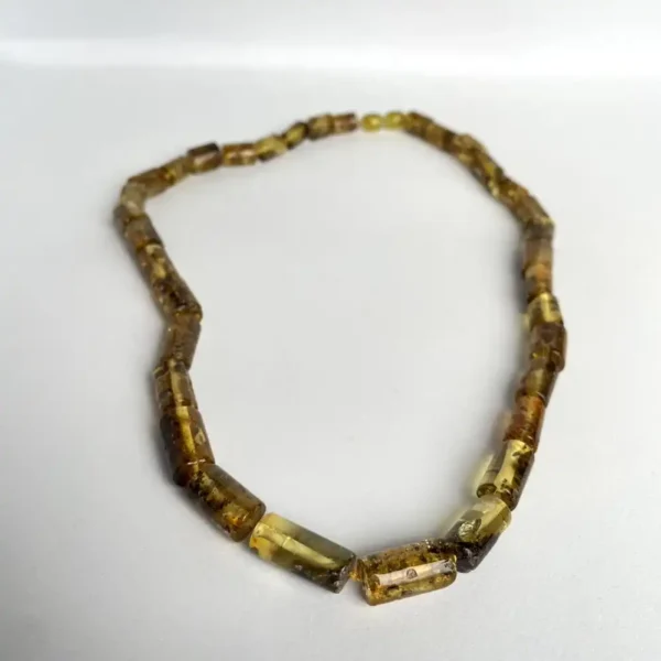 Elegant amber necklace featuring golden yellow and brown beads, perfect for any occasion.