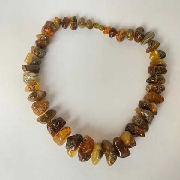 Unique amber necklace showcasing natural stones in various colors and organic shapes.