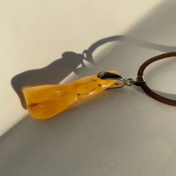 Elegant amber pendant, showcasing natural beauty and craftsmanship.