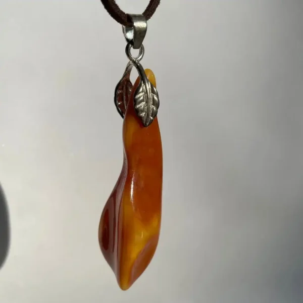 Elegant amber pendant, showcasing natural beauty and artisanal craftsmanship.