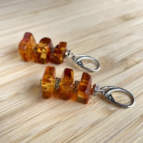 Stylish amber earrings with sparkling accents, perfect for any occasion.