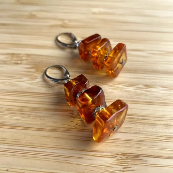 Elegant amber cube earrings, showcasing natural beauty and unique inclusions.