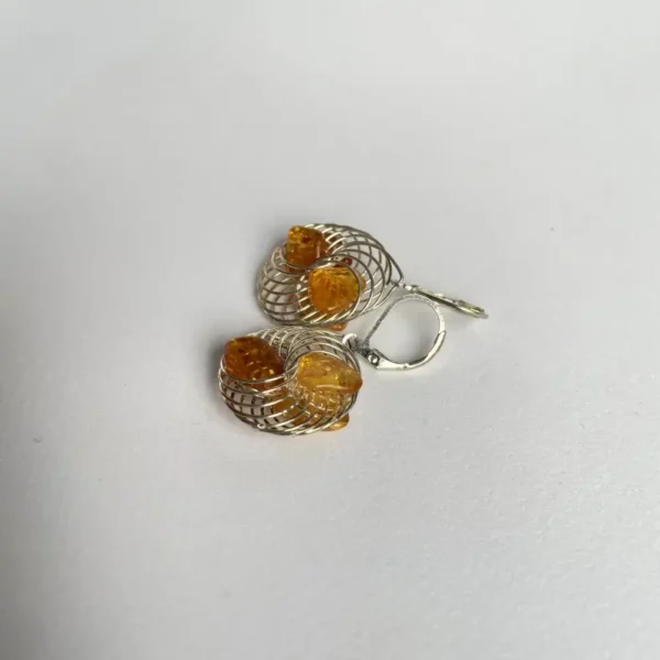 Elegant wire earrings featuring amber gemstones for a sophisticated and playful look.