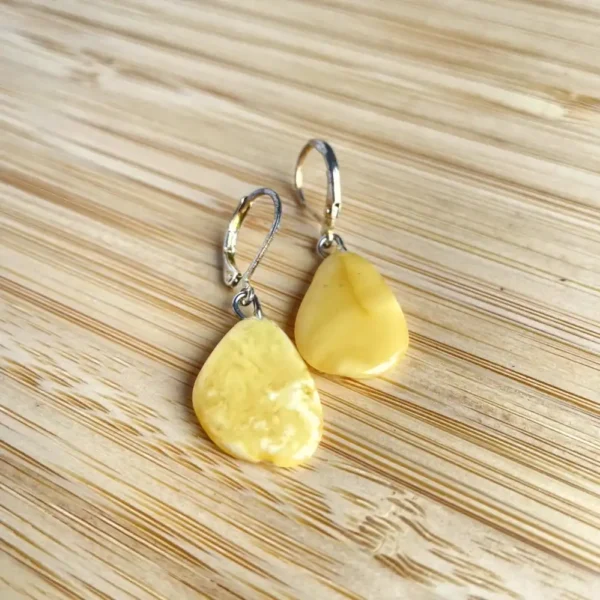 Elegant yellow teardrop earrings, perfect for any occasion.