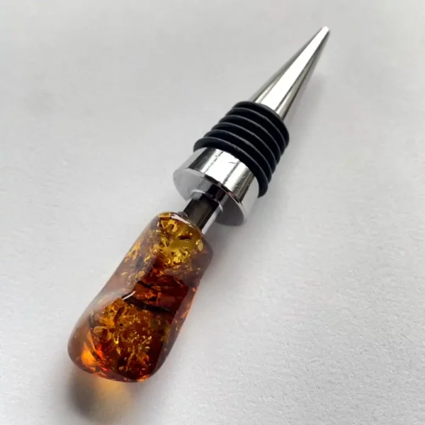 Elegant amber wine stopper with stainless steel, perfect for preserving wine freshness and style.