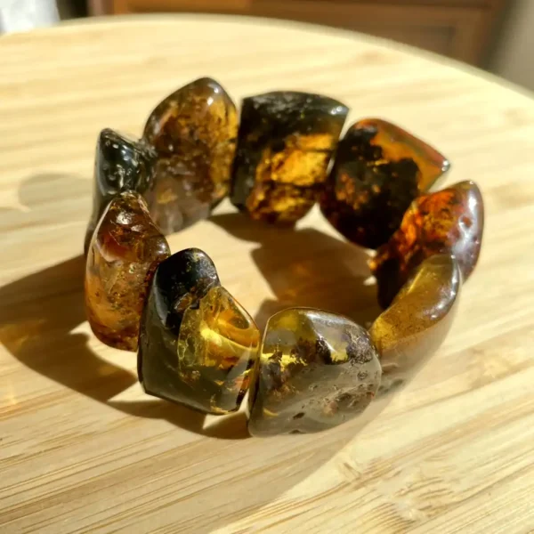 Polished amber bracelet featuring natural beads, showcasing warm hues and unique inclusions.