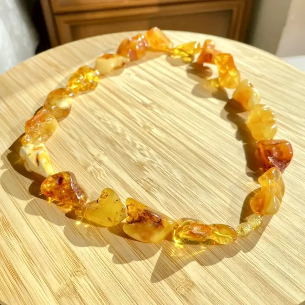 Stunning amber necklace on bamboo, showcasing unique beads and natural elegance.