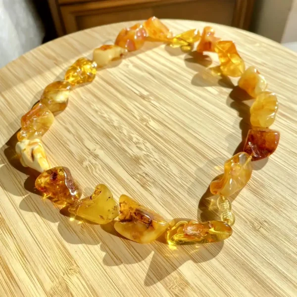 Unique amber necklace with irregular beads, showcasing warm colors and natural beauty.