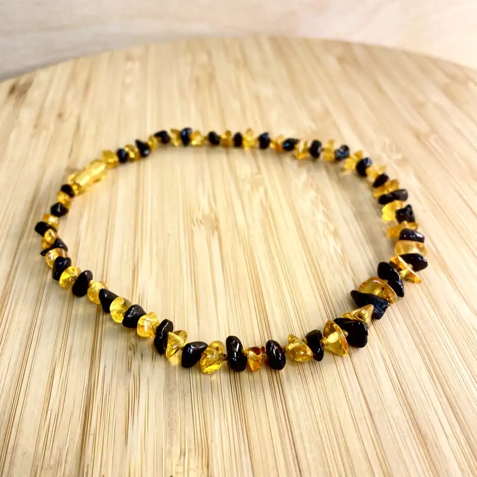 Amber teething necklace with a unique design, perfect for any occasion.