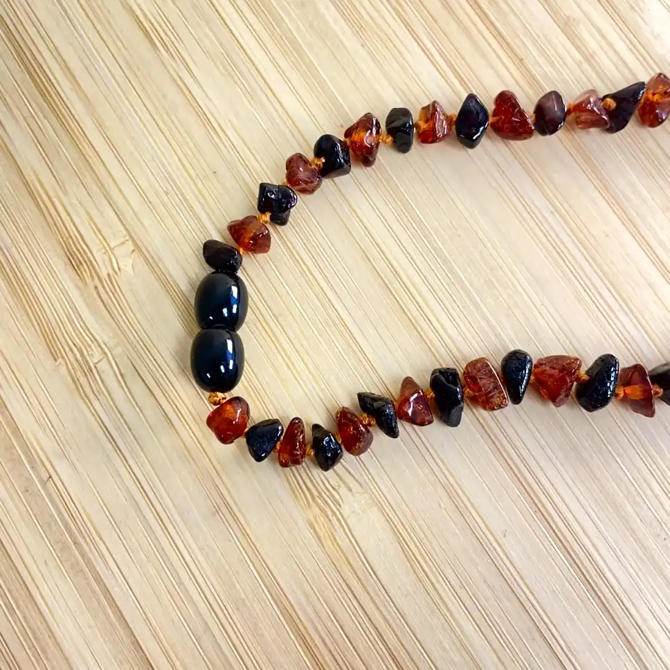 Stunning amber teething necklace, showcasing vibrant colors and artisanal craftsmanship.