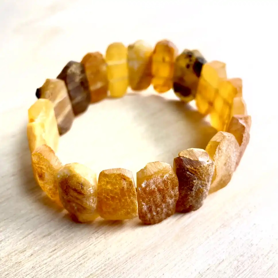 Elegant Amber Bracelet with Medium Stones showcasing golden hues and unique organic beads.