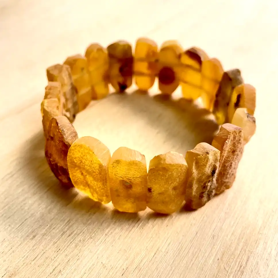 Elegant Amber Bracelet with Medium Stones featuring unique beads, perfect for nature lovers and handcrafted jewelry enthusiasts.