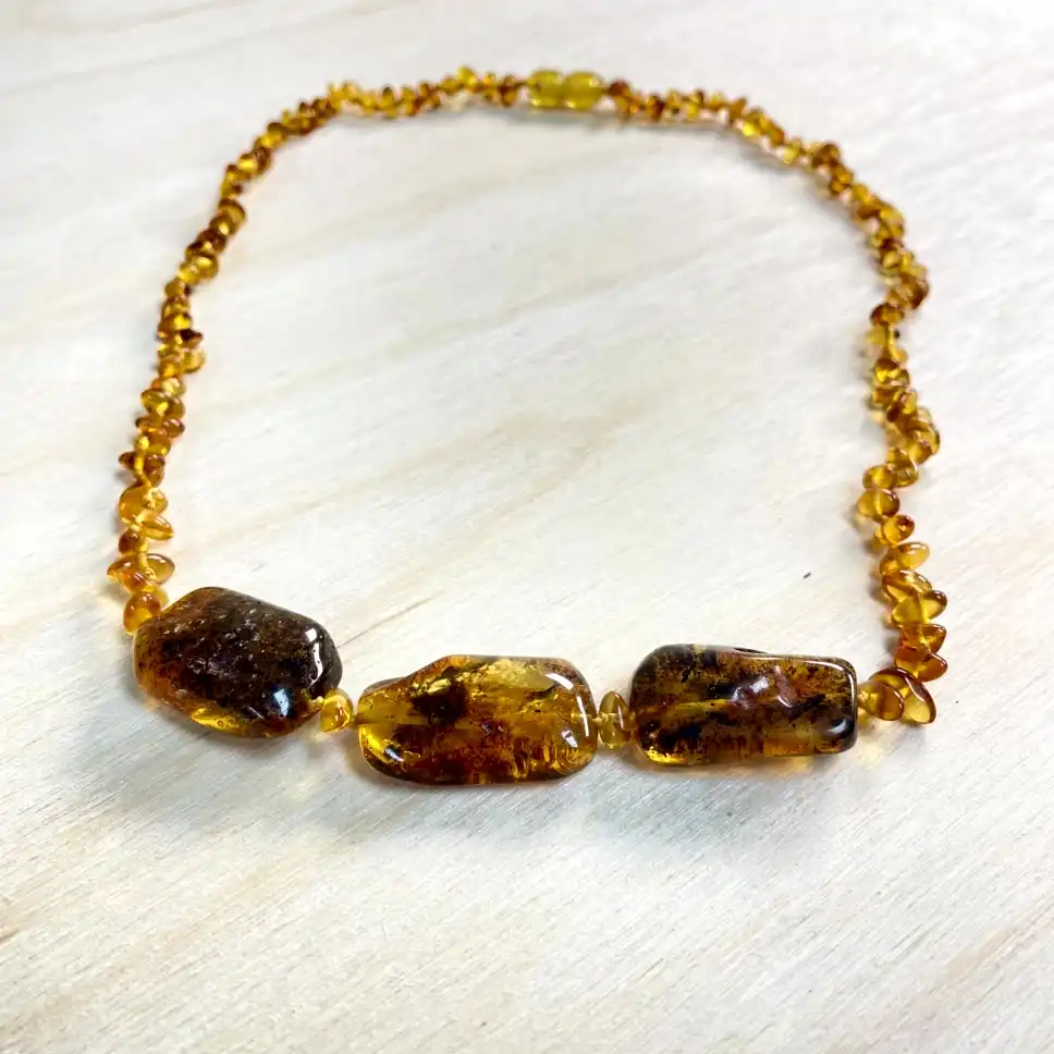 Elegant Amber Necklace with Medium Stones featuring polished beads and unique inclusions, perfect for any occasion.