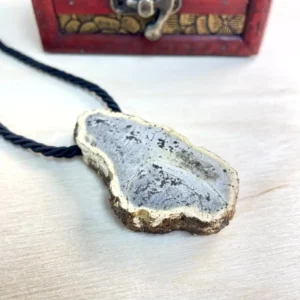 Stunning amber chunk necklace with gold trim, showcasing natural stone beauty and stylish black cord.