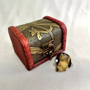 Ornate treasure chest with amber resin sculpture, showcasing vintage elegance and artistic craftsmanship.